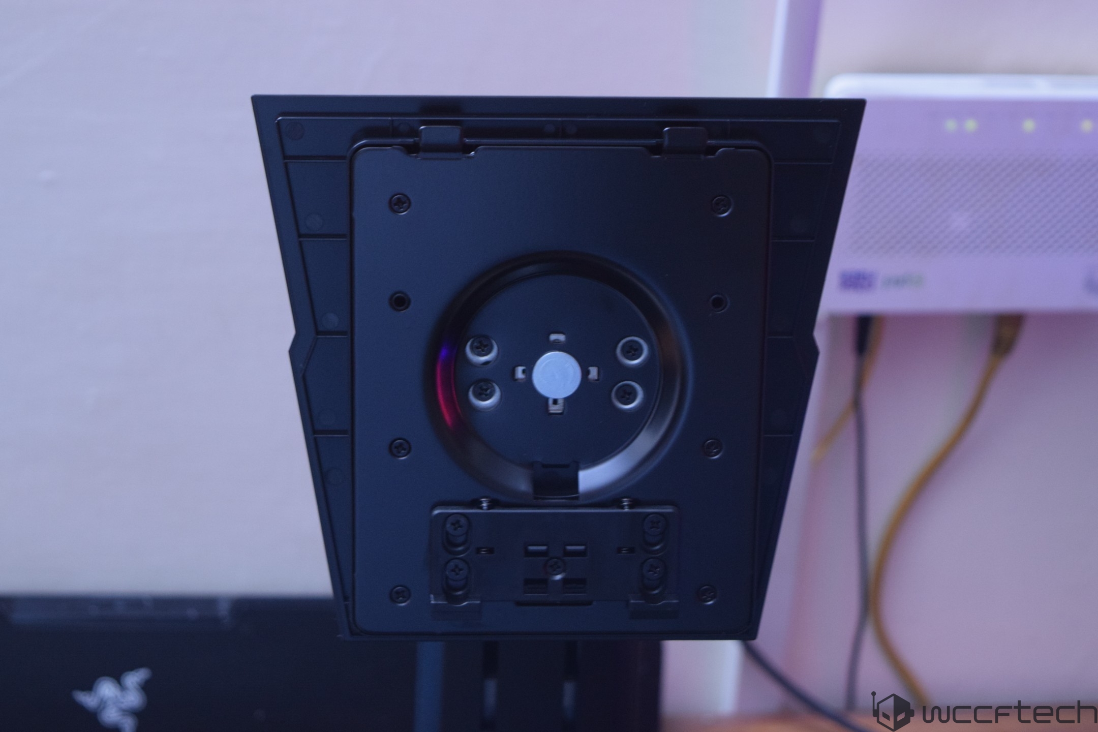 A close-up of the mounting bracket on the back of a Razer monitor displaying its attachment points.