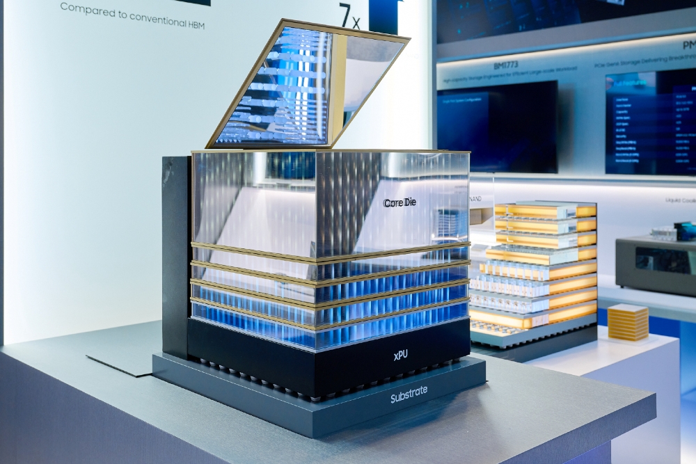 A close-up of Intel's 3D packaging technology model showing labeled components 'Core Die,' 'xPU,' and 'Substrate' against an exhibition backdrop.