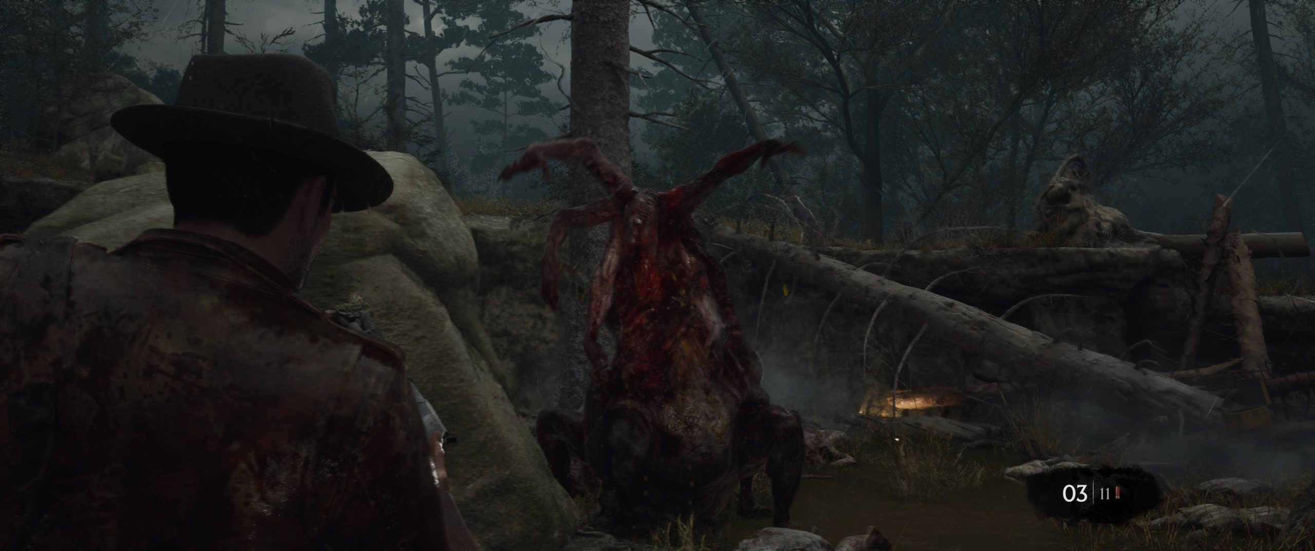 A character in a fedora confronts a grotesque creature in a forest setting in the game 'Alone in the Dark,' with an ammo count showing '03 | 11'.